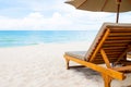 Wooden beach bed with umbrella at seaside scene. Tropical beach nature with clear blue sky and cloud. Holiday , vacation concept Royalty Free Stock Photo