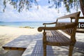 Wooden beach bench and the sea Royalty Free Stock Photo