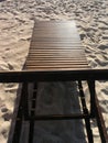 Wooden beach chairs on white sand beach in Thailand Royalty Free Stock Photo