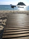 Wooden beach chairs on white sand beach in Thailand Royalty Free Stock Photo