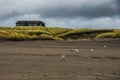 A Wooden Beach House Sit On A Small Hill On A Green Grassy Field In A Stormy Autumn Evening In Long Beach Washington Royalty Free Stock Photo