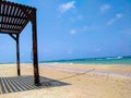 Wooden beach shed with a rope to the sea