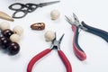 Wooden beads and tools for creating fashion jewelry in the manuf Royalty Free Stock Photo