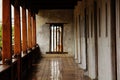 Old wooden beams cling to the old cement wall. Royalty Free Stock Photo