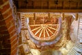 Wooden beams, attic. Part of the reconstruction of an ancient castle tower. Wooden roof elements. Latvia Bauka castle.