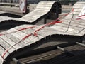 Wooden bed on a sea bridge wrapped with barrier tape