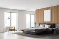 Wooden bedroom interior with bed and concrete floor, mockup poster Royalty Free Stock Photo