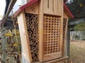 Wooden bee house or hive with small holes