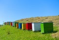 Wooden beehives on a sunny meadow and mowed grass.