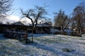 wooden beehives in a snow shower. Snow falls on homemade wooden Royalty Free Stock Photo