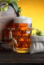 Wooden beer barrel with fresh hop cones and glass of beer Royalty Free Stock Photo