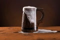Wooden beer mug with foam. Royalty Free Stock Photo
