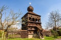 Wooden bell tower belonging to a wooden church in Hronsek, registered as a UNESCO World Heritage Site. Royalty Free Stock Photo