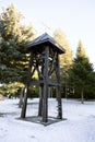 Wooden bell tower in an orthodox monastery in winter Royalty Free Stock Photo