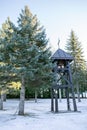 Wooden bell tower in an orthodox monastery in winter Royalty Free Stock Photo