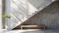 Wooden bench against grey wall and staircase.