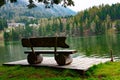 Wooden bench on an Austria lakeside Royalty Free Stock Photo