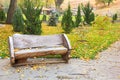 Wooden bench in autumn park