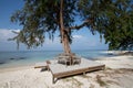 Wooden bench on the beach Royalty Free Stock Photo