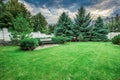 Wooden bench in a beautiful park garden. Royalty Free Stock Photo