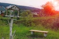 Wooden bench and birdhouse in Carpathians