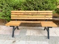 Wooden bench built to keep social distance due to the corona virus epidemic Royalty Free Stock Photo