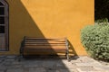 Wooden bench chair exterior with light shade Royalty Free Stock Photo