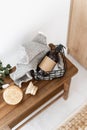 Wooden bench with cosmetics products, soap dispenser in a basket, towel and brushes Royalty Free Stock Photo