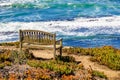 Wooden Bench on the Edge of a Cliff, Pacific Ocean coastline, Moss Beach, California Royalty Free Stock Photo