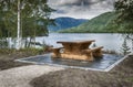 Wooden bench at fjord in norway