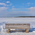 A wooden bench by the ice rink in LuleÃÂ¥ Royalty Free Stock Photo