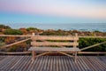 Wooden bench with its back to the sea on Cabopino beach, Marbella, Malaga, with the sea in the background Royalty Free Stock Photo