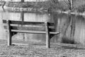 Wooden bench by lake