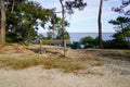 Wooden bench looking lake in dune sand beach Hourtin village in gironde France Royalty Free Stock Photo