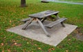 Wooden bench made of natural wood that turns gray over time. camping bench with table, curved bench made of solid wood arch. curve Royalty Free Stock Photo