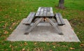 Wooden bench made of natural wood that turns gray over time. camping bench with table, curved bench made of solid wood arch. curve Royalty Free Stock Photo