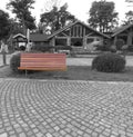 Wooden bench in monochrome city
