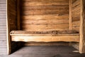 Wooden bench near wooden walls. Ecohouse, natural materials