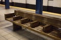 Wooden bench in NYC subway station Royalty Free Stock Photo