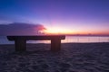 Wooden bench over beautiful tropical beach and magical twilight