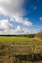 Wooden bench overlooking an English landscape Royalty Free Stock Photo