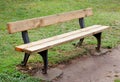 Wooden bench in the park on grass Royalty Free Stock Photo