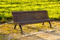 Wooden bench in a park at sunset Royalty Free Stock Photo