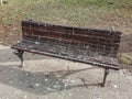 Bird droppings on wooden bench in the park. Splatters of bird feces on wooden bench in the park.