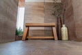 Wooden bench at relaxing corner with Two wooden vases with Dried flowers nearby Royalty Free Stock Photo