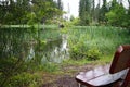 Wooden bench for relaxing in the popular mountain lake in Liptov - Vrbicke lake.