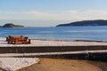 Wooden bench on the shore of the fjord