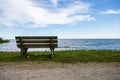 Wooden bench on the shore of a lake in Kingsville, Ontario Royalty Free Stock Photo
