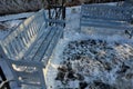 wooden bench on stone gray pavement in the park with Royalty Free Stock Photo