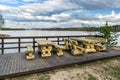 Wooden bench and table made of tree trunks